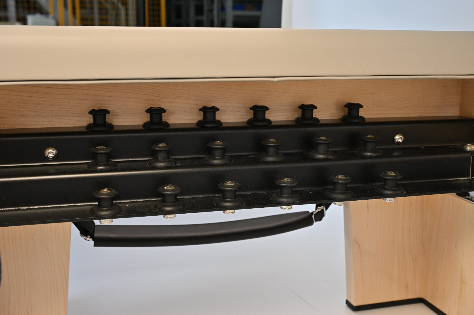 Spring attachment rail on the STRETCH S1 Maple Edition, showing the resistance mounting points