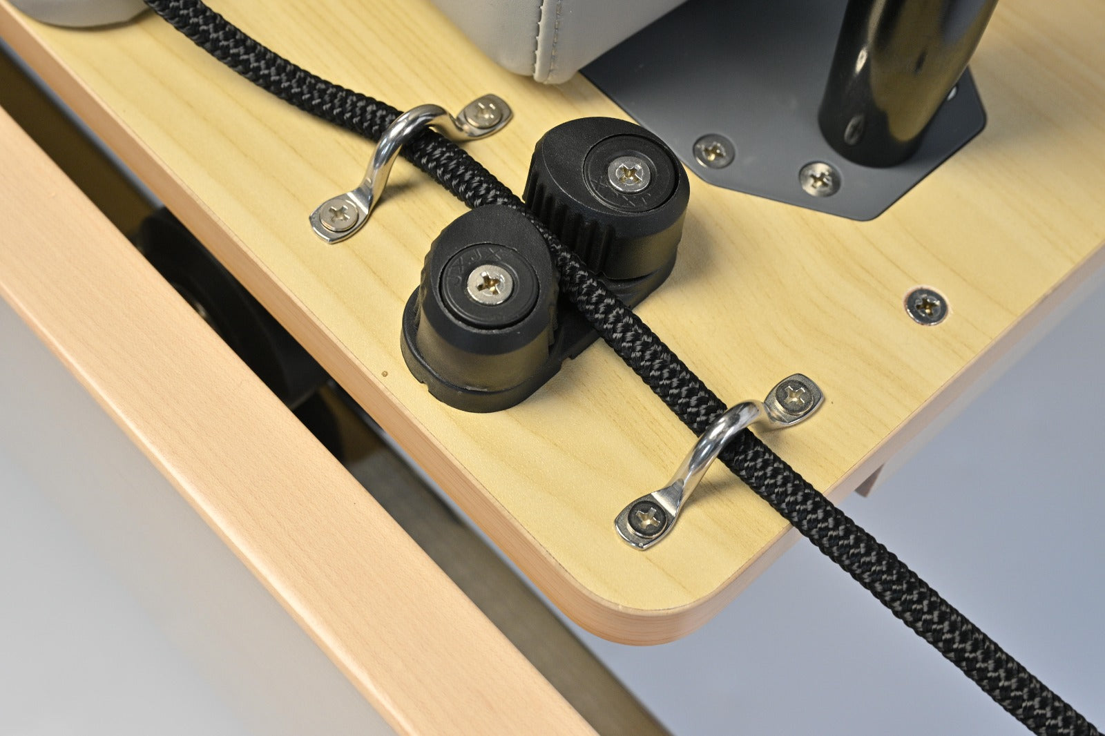 Precision rope cleats and pulley system on the STRETCH S1 Maple Edition's solid maple frame
