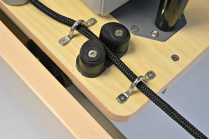 Precision rope cleats and pulley system on the STRETCH S1 Maple Edition's solid maple frame
