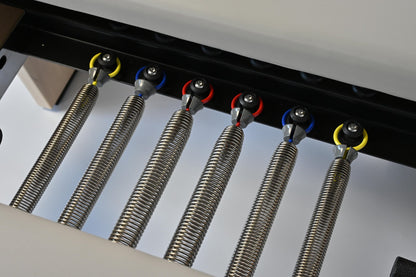 Close-up of the STRETCH S1 Maple Edition's colour-coded imported piano-wire springs